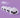A round, face-stamped translucent squishy toy with glitter on a pastel violet surface, with three identical blurred copies behind it.